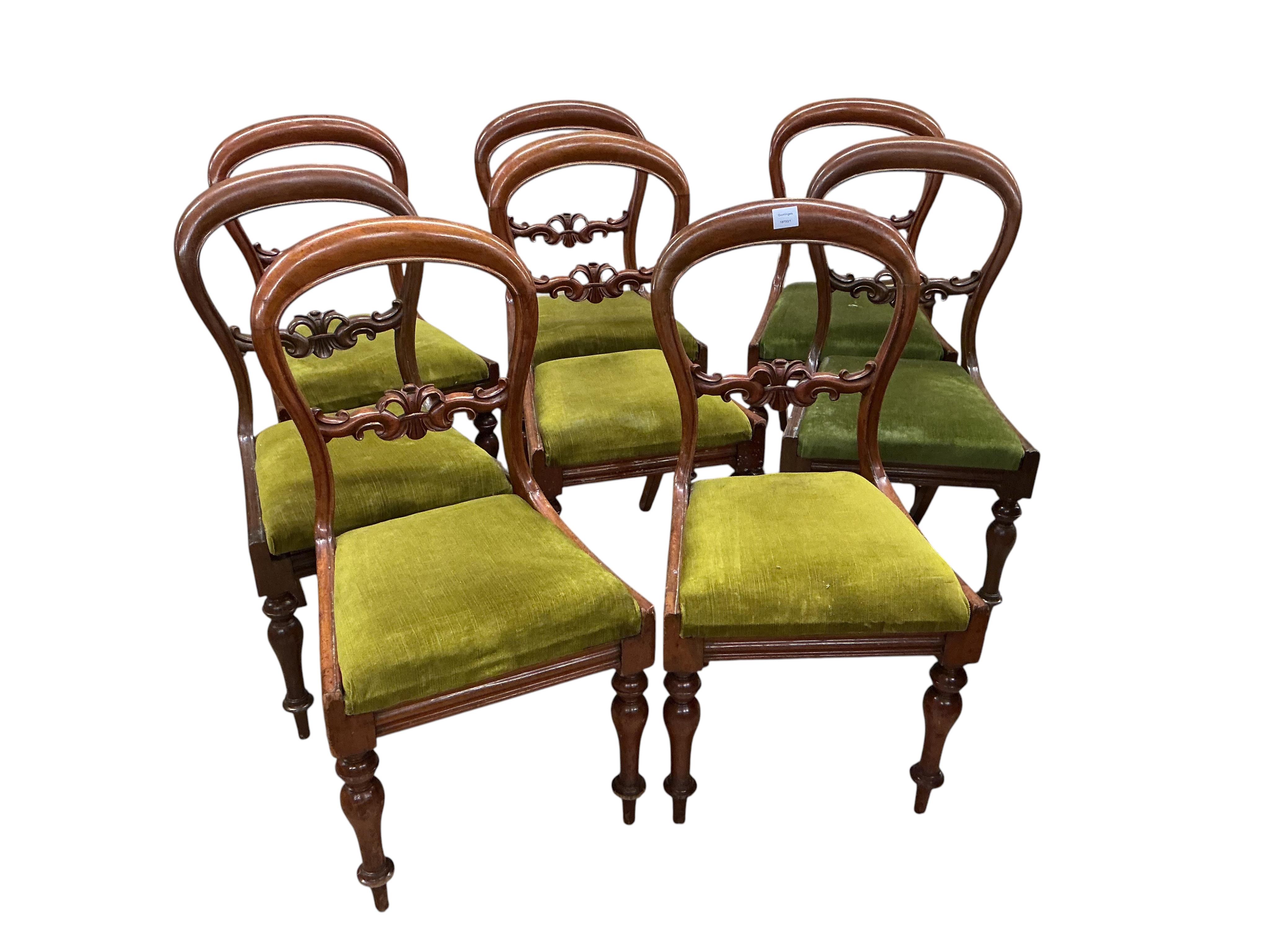 A George III satinwood banded mahogany D end extending dining table, with two spare leaves, 284cm extended, depth 120cm, height 74cm, together with a set of eight Victorian mahogany balloon back dining chairs